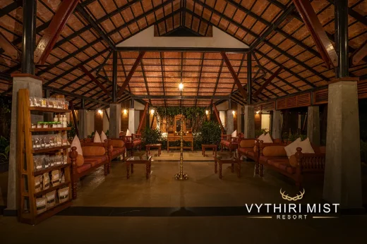 Cozy lobby area with comfortable seating at Vythiri Mist Resort