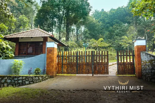 luxury resort entrances surrounded by lush greenery in Wayanad